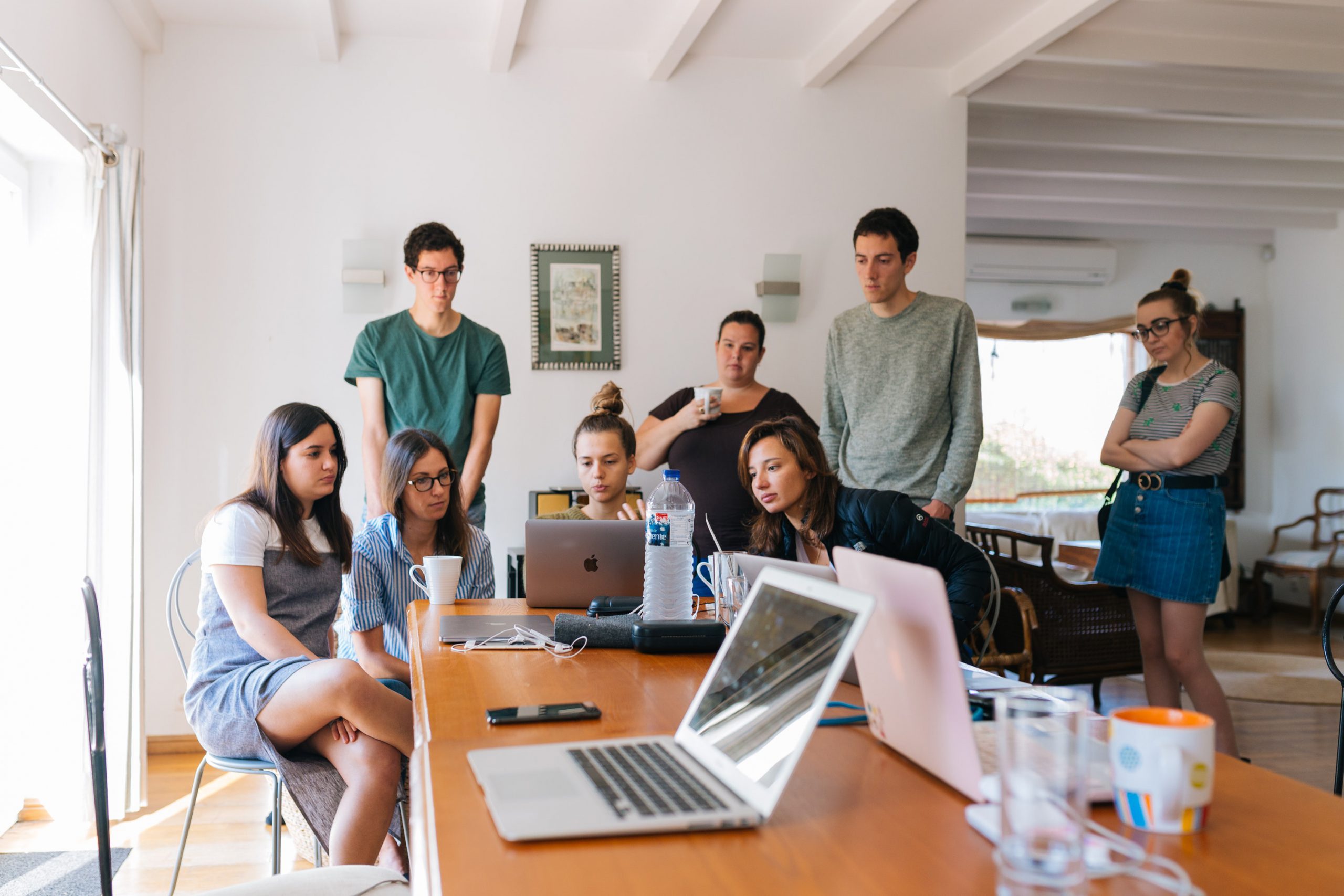 group of people watching on laptop  scaled